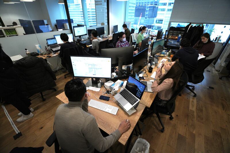 Staff of artificial intelligence company GumGum Japan work at their office in Tokyo.