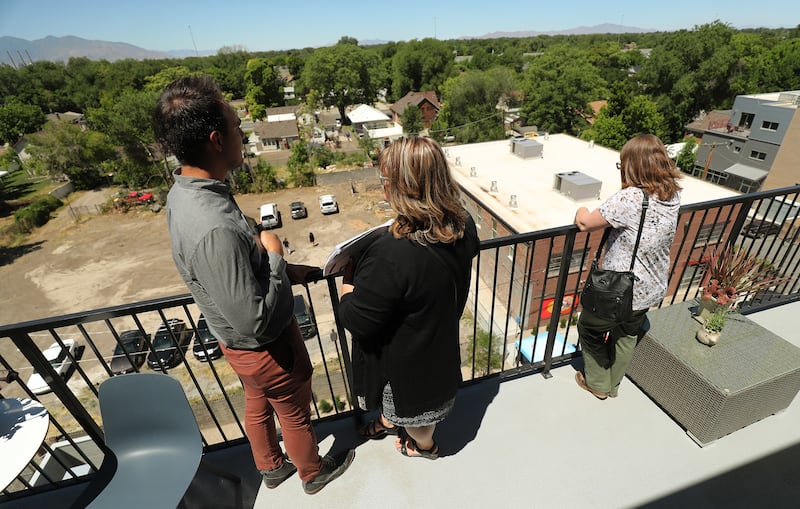 Tours are given during an opening event for a net-zero emissions apartment building called Project Open in Salt Lake City on Tuesday, June 12, 2018. Its developers say it's the tallest net-zero apartment building in Utah and the first to be built for the