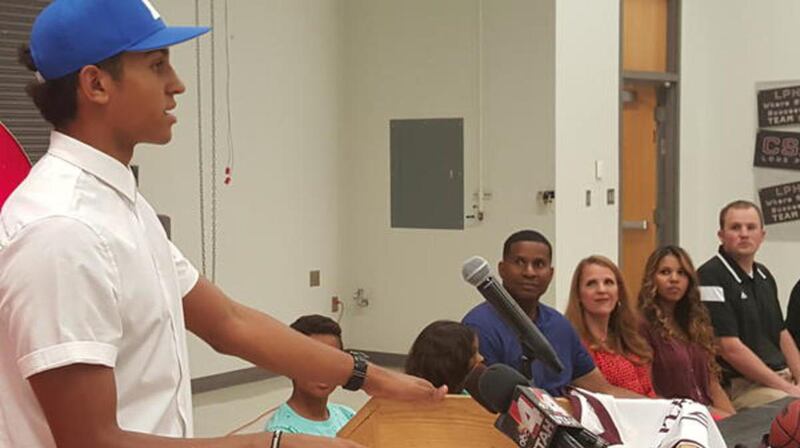 Lone Peak guard Frank Jackson commits to Duke in front of family and friends at Lone Peak High School on Tuesday.