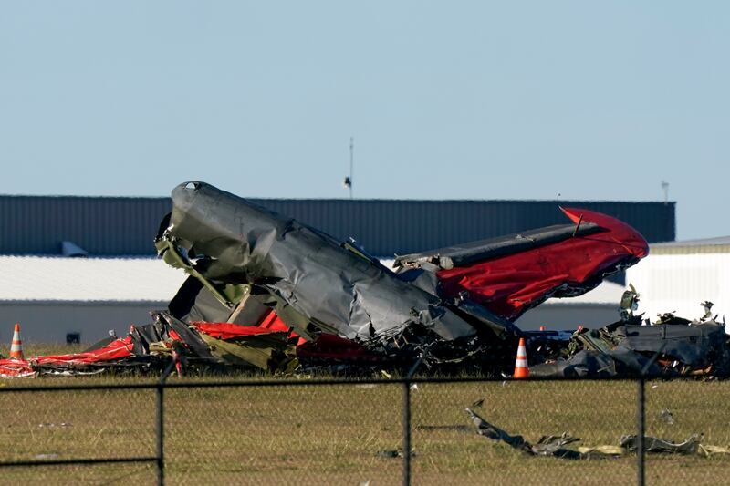 Debris from two planes that crashed during an airshow at Dallas Executive Airport are shown in Dallas.