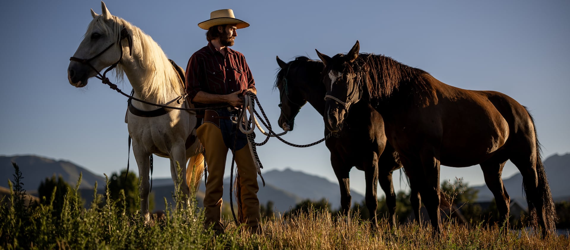 Jake Harvath with his three horses, Bella, Denver and Eddy, at Sage Creek Equestrian in Charleston, Utah.
