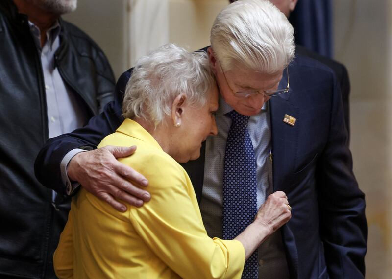 Former Sen. Karen Mayne embraces Sen. Don Ipson, R-St. George, in the Senate after a bill that creates a scholarship for law enforcement officers passed at the Capitol in Salt Lake City on Friday. The scholarship is named after Mayne, who retired earlier this year.