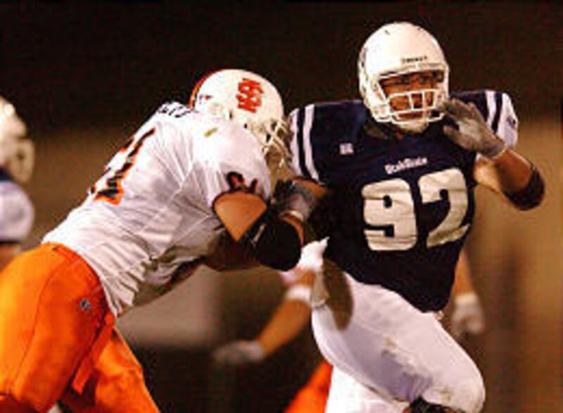 Utah State noseguard Ronald Tupea, right, is one of the top returning players for the Aggie defense, which hopes to be improved.
