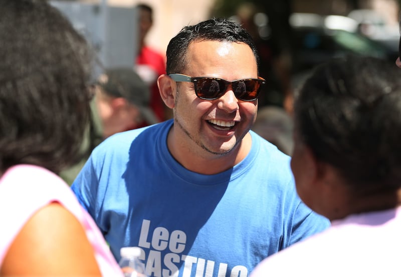 FILE - Lee Castillo campaigns during the Juneteenth Festival in Ogden on Saturday, June 16, 2018. Layton's Castillo has a big early edge over Bountiful's Kurt Weiland in Tuesday's Democratic primary, with both aiming to take on eight-term Republican Congr