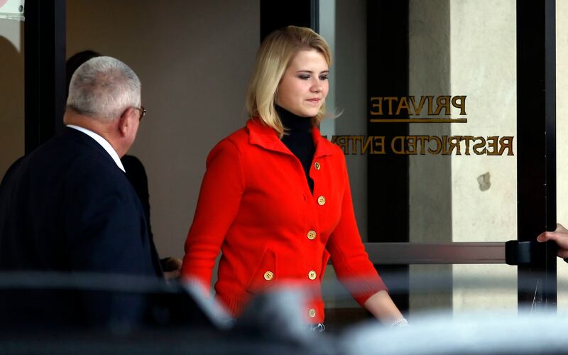 Elizabeth Smart with her parents Ed and Lois exit the federal court after proceedings ended on monday. The trial for Brian David Mitchell starts again at the Federal Court house in Salt Lake City. Monday, Nov. 8, 2010. Photo by Scott G Winerton Deseret Ne