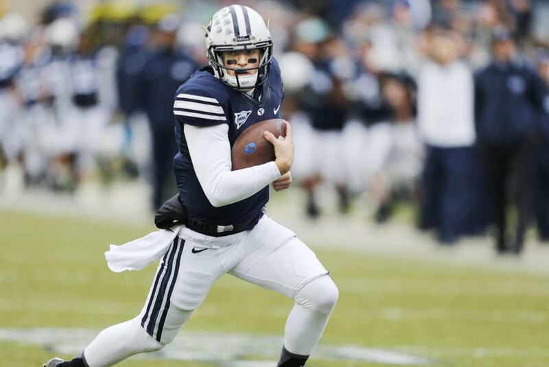 Brigham Young Cougars quarterback Christian Stewart (7) runs for a touchdown against the Savannah State Tigers in Provo Saturday, Nov. 22, 2014.