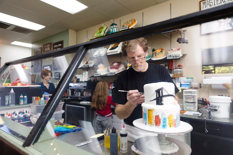 Jack Phillips, owner of Masterpiece Cakeshop in Lakewood, Colorado, decorates a cake for a client.