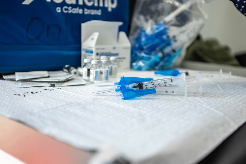 Health care worker Qing Chong prepares COVID-19 vaccines for a pop-up vaccination event at Reams in Magna on May 3, 2021.