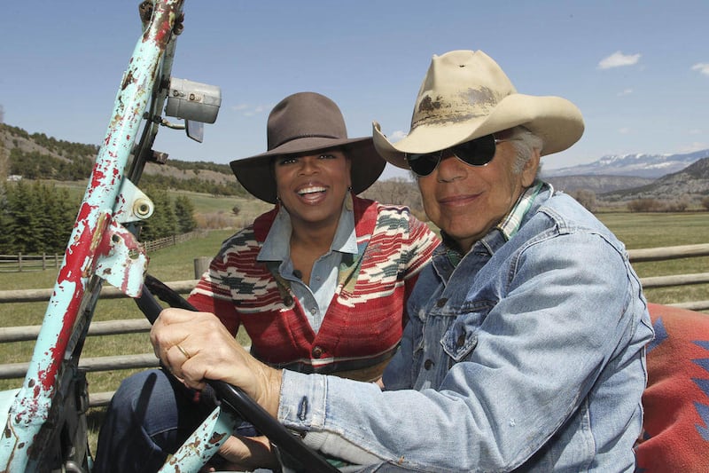 In this photo taken May 7, 2011 provided by Harpo Productions, Inc., talk-show host Oprah Winfrey rides in a jeep with fashion designer Ralph Lauren at Lauren's RRL Ranch outside Telluride, Colo. Winfrey was at the ranch to interview Lauren for an episode