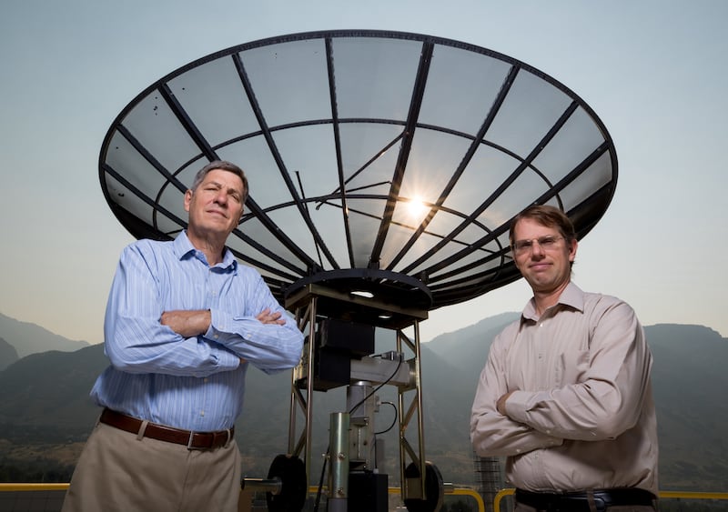 BYU professors Brian Jeffs and Karl Warnick pose for a photo on the roof of the Clyde Building in Provo on Saturday, Aug. 6, 2018.