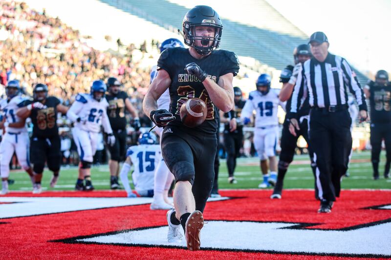 Lone Peak's Kobe Freeman (24) scores a touchdown during the 6A football semifinal against Pleasant Grove at Rice-Eccles Stadium in Salt Lake City on Thursday, Nov. 8, 2018.