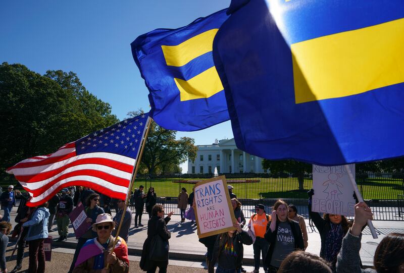 The National Center for Transgender Equality and the Human Rights Campaign gather on Pennsylvania Avenue in front of the White House in Washington, Monday, Oct. 22, 2018, for a #WontBeErased rally.