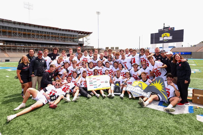 Utah lacrosse poses with the trophy after winning the 2024 ASUN Conference championship.