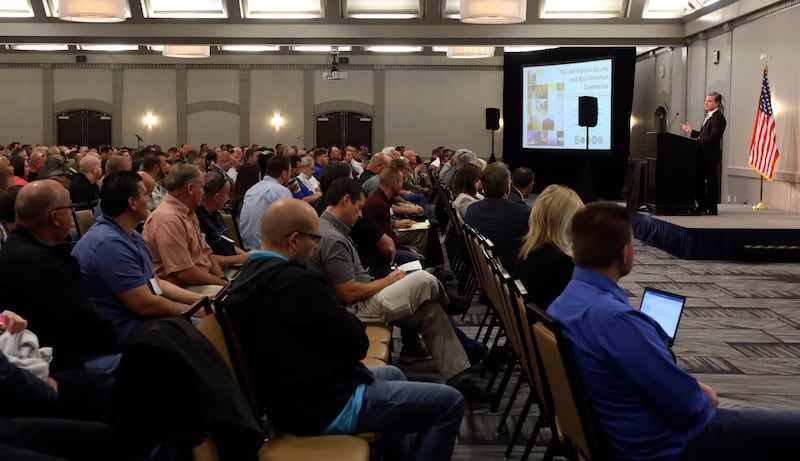 FBI Director Christopher A. Wray gives his keynote address at the 11th annual Utah National Security and Anti-Terrorism Conference at the Sheraton Salt Lake City Hotel in Salt Lake City on Wednesday, Aug. 29, 2018.