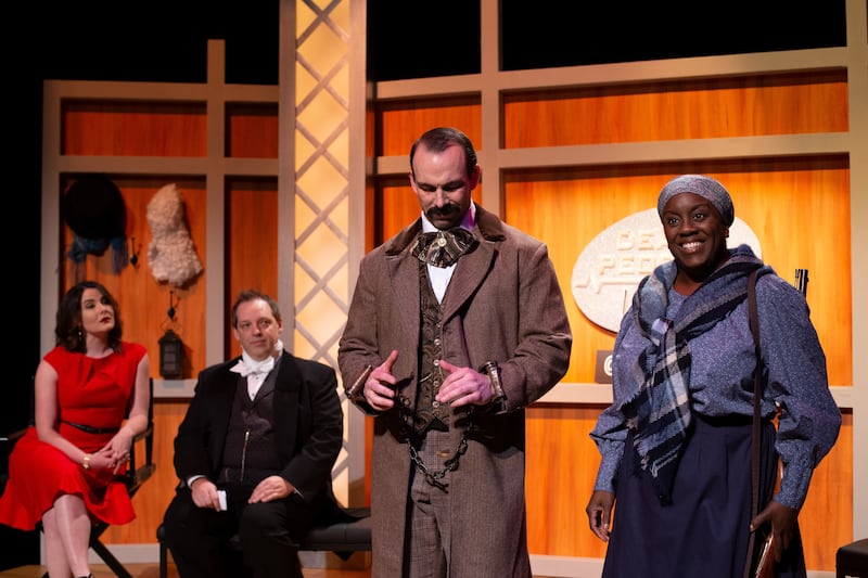 Emilie Starr as the host, left, Jason Bowcutt as James Buchanan, Aaron Adams as John Wilkes Booth and Dee-Dee Darby-Duffin as Harriet Tubman in "An Evening With Two Awful Men" by Elaine Jarvik.