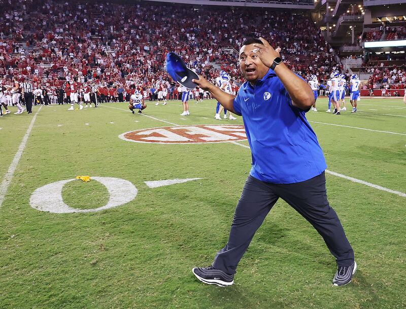BYU coach Kalani Sitake celebrates a win over Arkansas at Razorback Stadium in Fayetteville on Saturday, Sept. 16, 2023.
