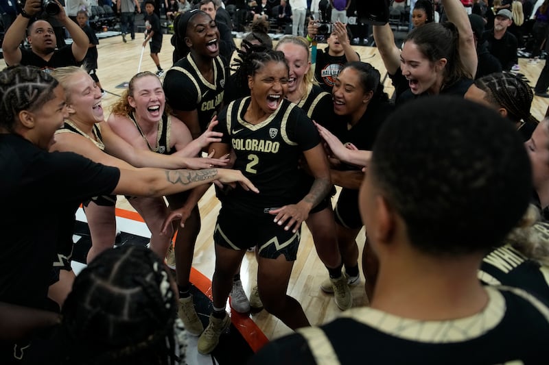 Colorado players celebrate after defeating LSU in an NCAA college basketball game Monday, Nov. 6, 2023, in Las Vegas.