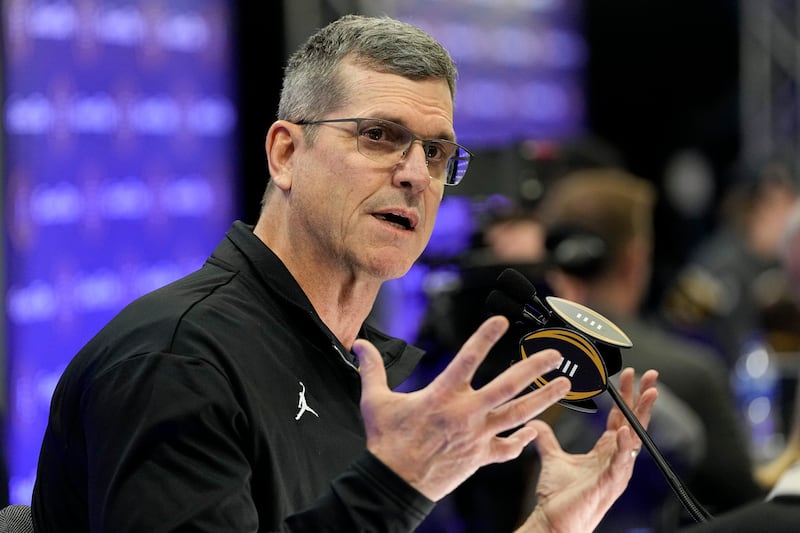 Michigan head coach Jim Harbaugh is interviewed during media day ahead of the College Football Playoff championship game between Washington and Michigan Saturday, Jan. 6, 2024.