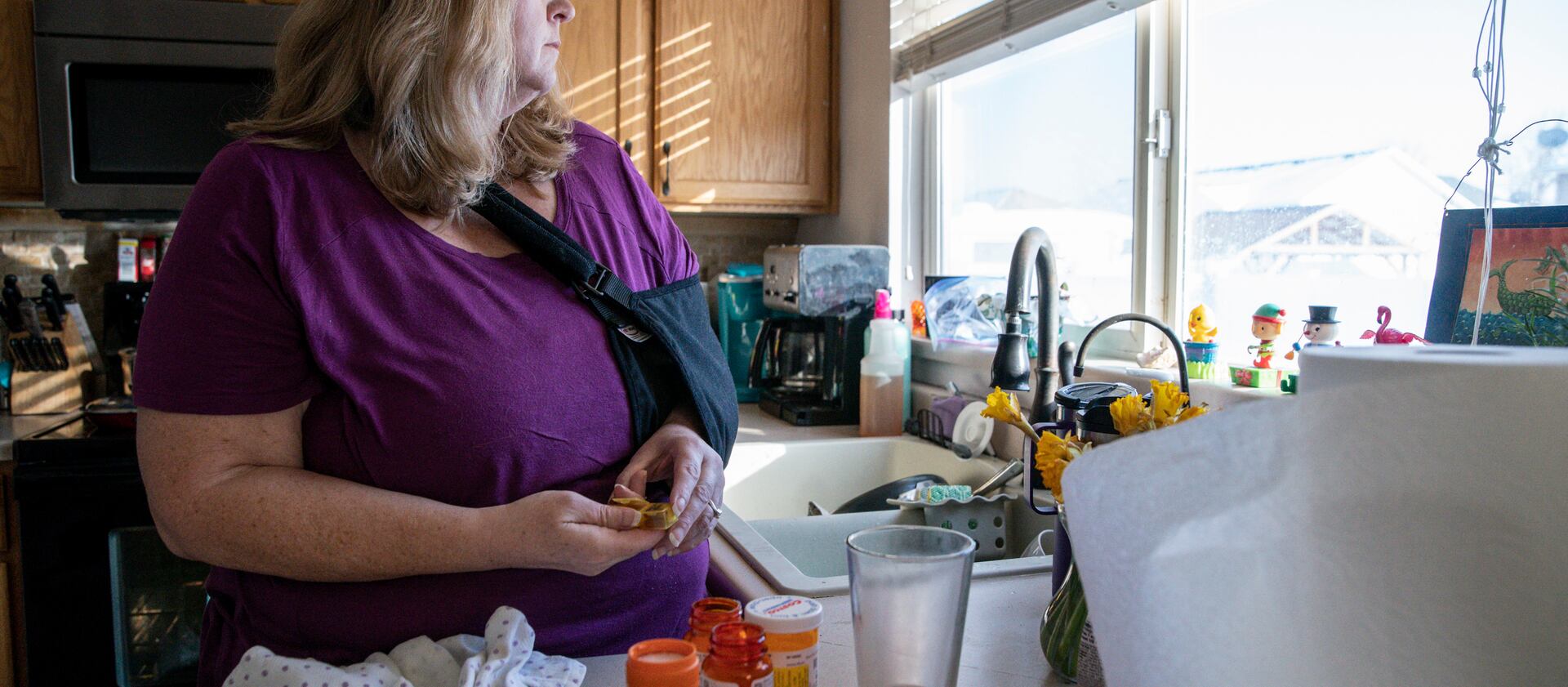 Meg Jackson-Drage watches doves in her backyard in Magna, Utah. Jackson-Drage has joined an effort to make prescription drugs more affordable.