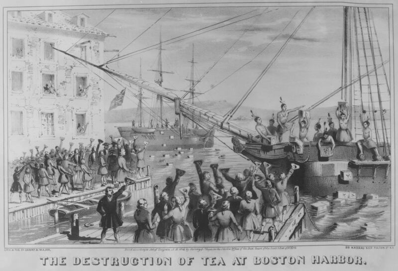 Colonists dumping tea into the Boston Harbor.