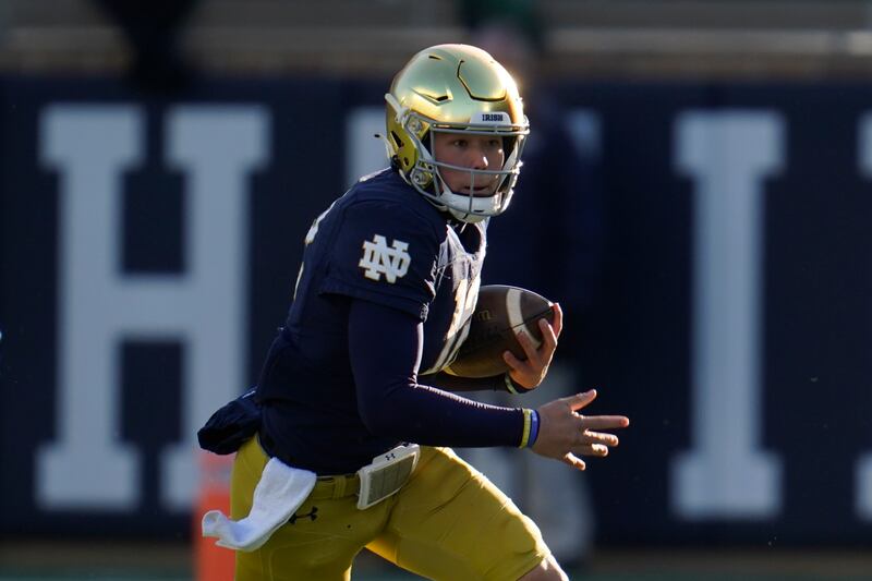 Notre Dame quarterback Tyler Buchner runs against Navy during a game in South Bend, Ind., Saturday, Nov. 6, 2021.