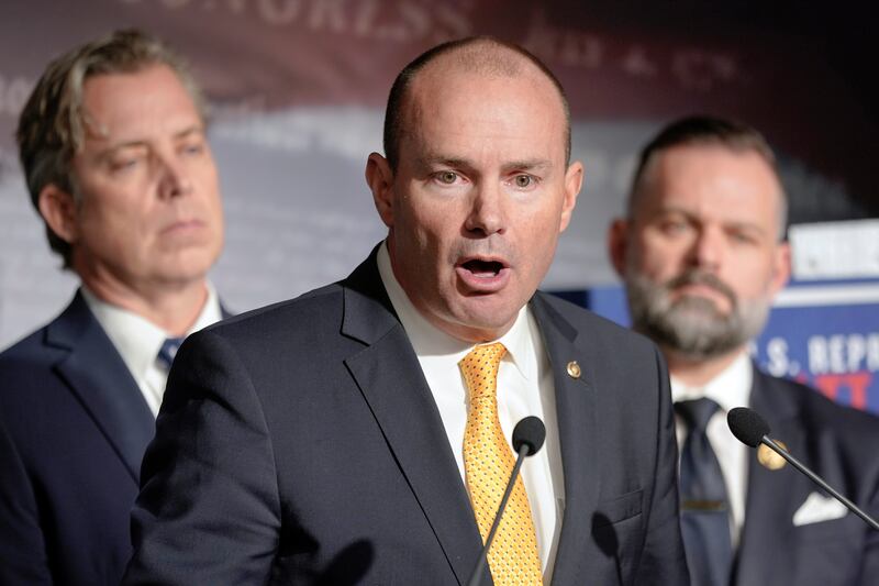 Sen. Mike Lee speaks during a news conference on Capitol Hill on Wednesday as Rep. Cory Mills and Rep. Andrew Ogles listen.