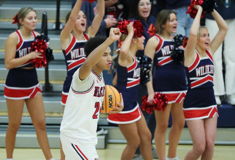 Woods Cross’ Mason Bendinger, wearing white, celebrates the victory.