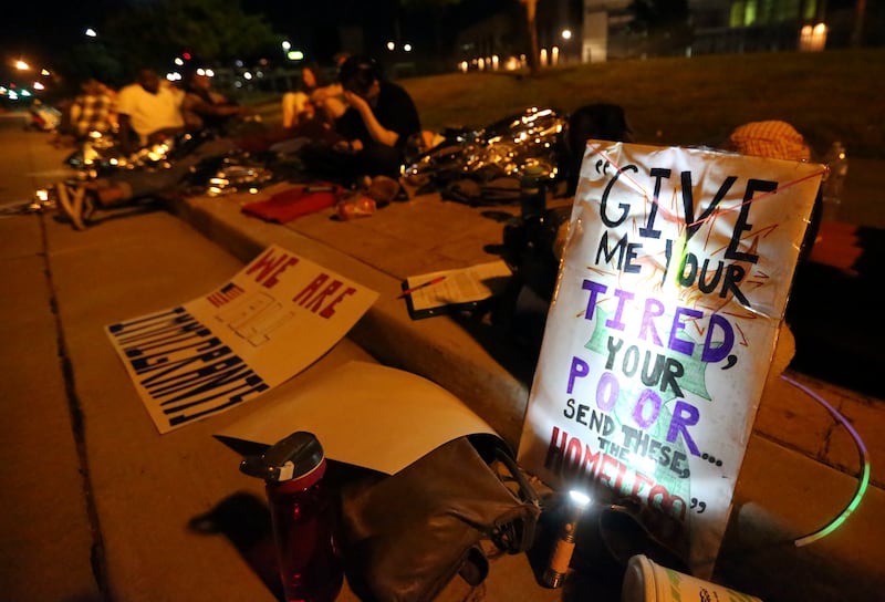 Activists protest migrants’ treatment at the border, deportations and border camps by camping outside of the U.S. Immigrations and Customs Enforcement field office in West Valley City on Wednesday, July 24, 2019.