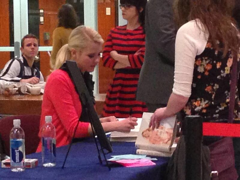 Elizabeth Smart signs copies of her book after her address at BYU on Wednesday night.