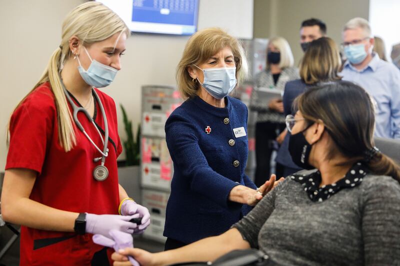 American Red Cross President and CEO Gail McGovern talks to a donor during a Red Cross blood drive at BYU in Provo, Utah.