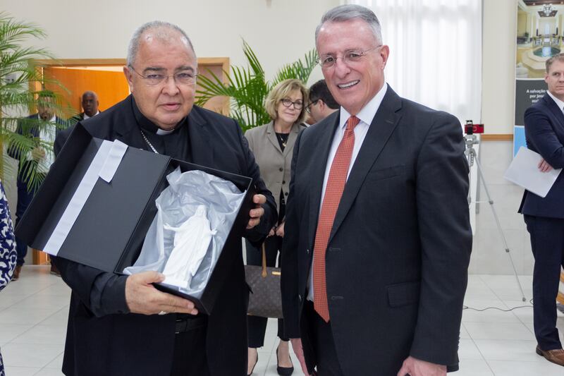 Cardinal Orani Tempesta, left, of Rio de Janeiro, displays a gift from Elder Ulisses Soares of the Quorum of the Twelve Apostles.