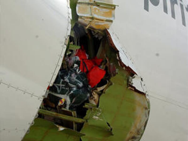 The right wing damaged fuselage of Qantas Airways Boeing 747-400 is seen after it made an emergency landing Friday in Manila, Philippines.