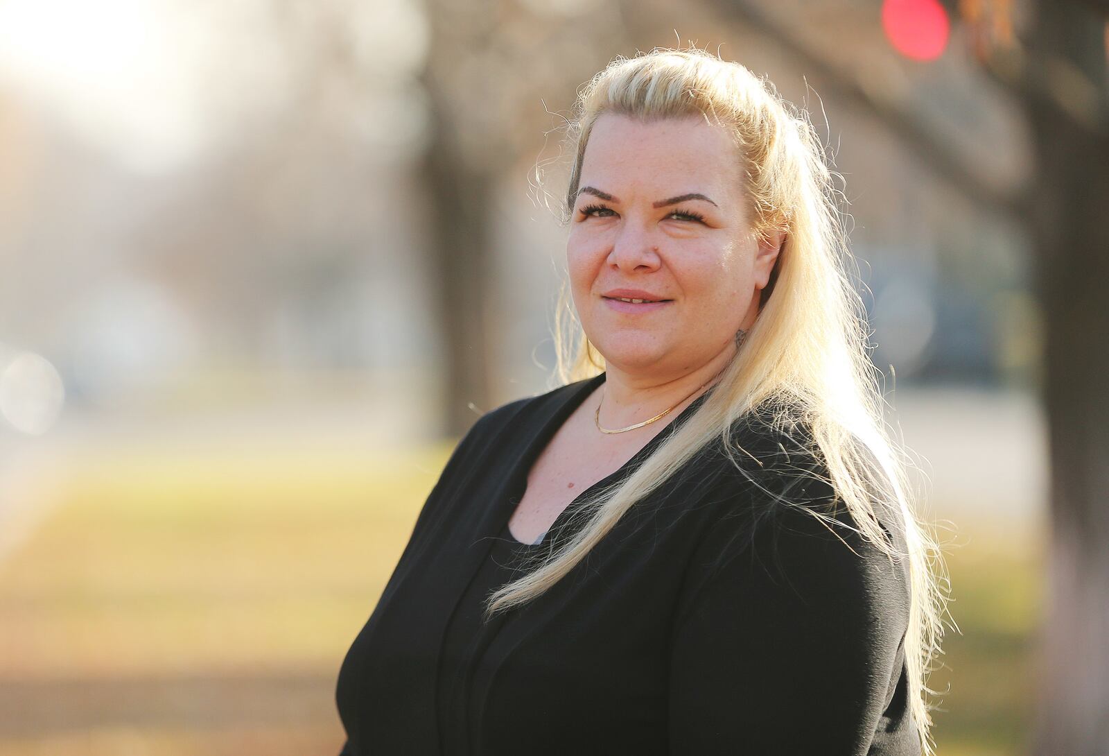 Jenna Uitdenhowen poses for a photo in Salt Lake City on Nov. 30, 2017. Uitdenhowen was a nurse and became addicted to opioids after a car crash. She now works at Odyssey House as a medical coordinator.