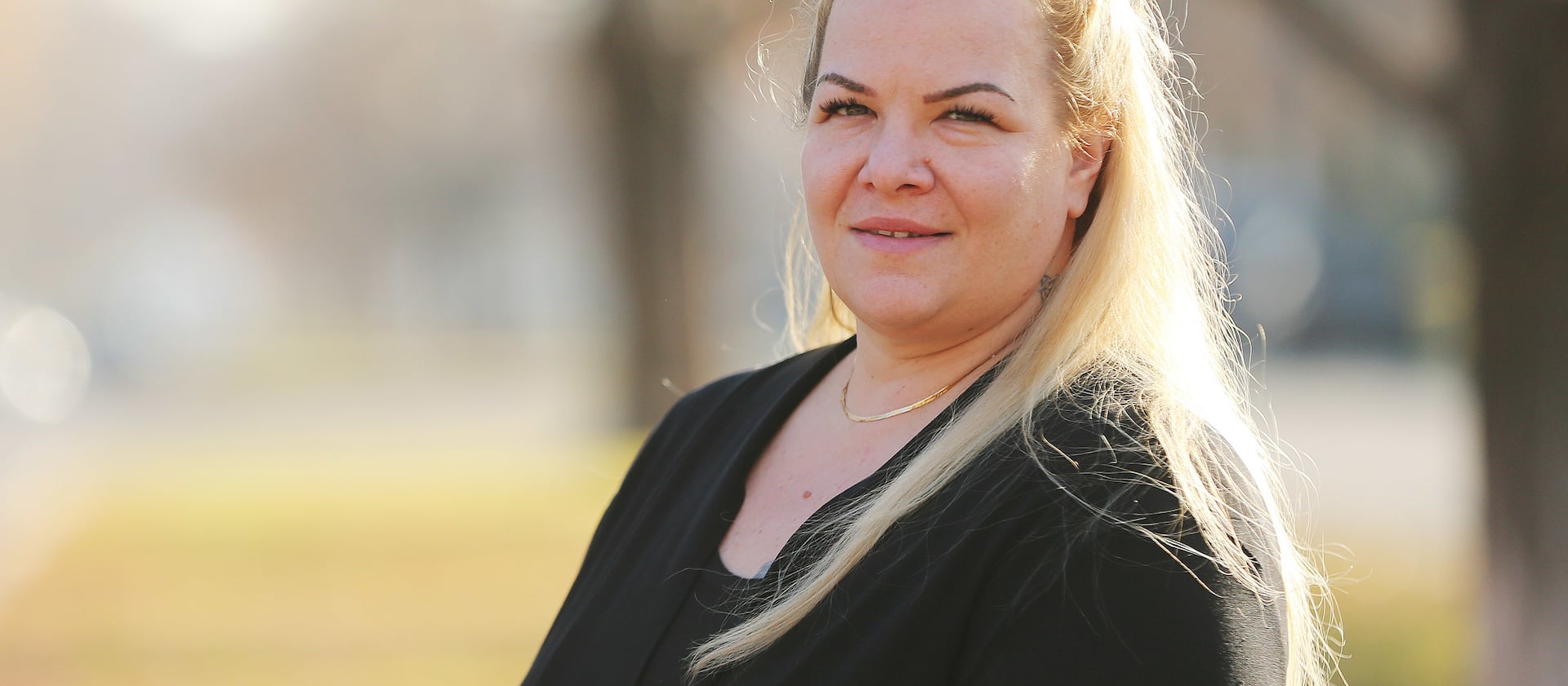 Jenna Uitdenhowen poses for a photo in Salt Lake City on Nov. 30, 2017. Uitdenhowen was a nurse and became addicted to opioids after a car crash. She now works at Odyssey House as a medical coordinator.