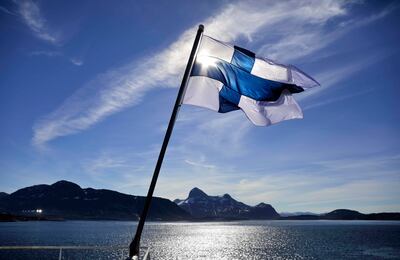 FILE - In this Saturday, July 29, 2017 file photo, Finland's flag flies aboard the Finnish icebreaker MSV Nordica as it arrives into Nuuk, Greenland. Finland has come out on top of an international index that ranks nations by how happy they are as places