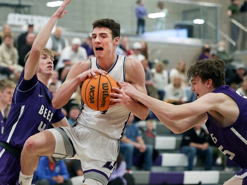 Box Elder’s Cole Mortensen and Maxwell Isaacson try to stop Lehi’s Braxton Hawkins.