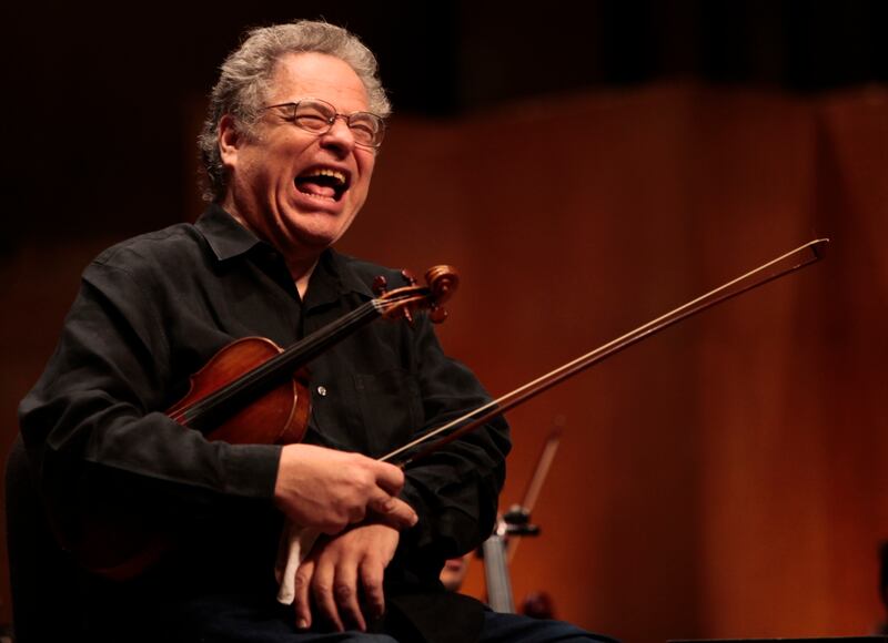 American-Israeli violinist Itzhak Perlman laughs during rehearsal at Teresa Carreno Theatre in Caracas, Venezuela.