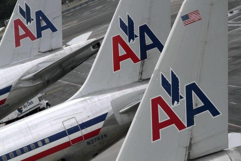 American Airlines airplanes are parked at their gates at JFK International Airport in New York.
