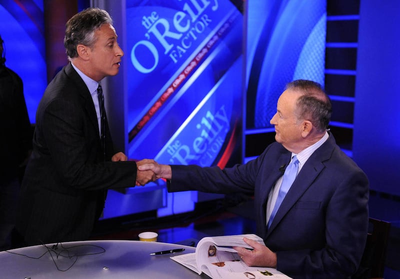 FILE - In this Sept. 22, 2010 file photo, Comedy Central's Jon Stewart, left, and Bill O'Reilly tape an interview in New York. Stewart and O'Reilly, a celebrity odd couple with a history of public political feuds, tangle in a sold-out debate in Washingto