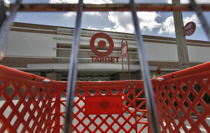 In this Monday, Aug. 19, 2013 file photo, a shopping cart is parked outside a Target store.