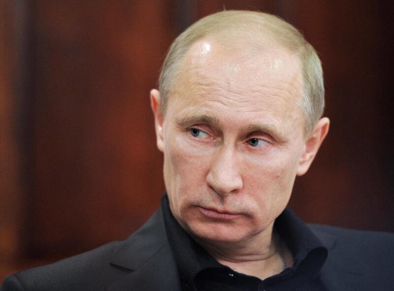 Russian Prime Minister Vladimir Putin attends a meeting while visiting a shipbuilding plant in St. Petersburg, Russia, Friday, Dec. 2, 2011.