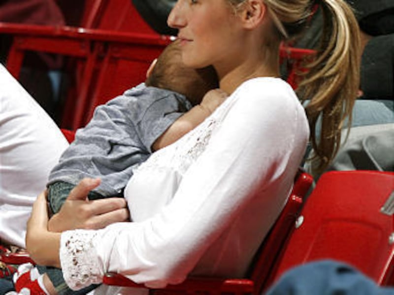 USC basketball player Brynn Cameron sits with her son.