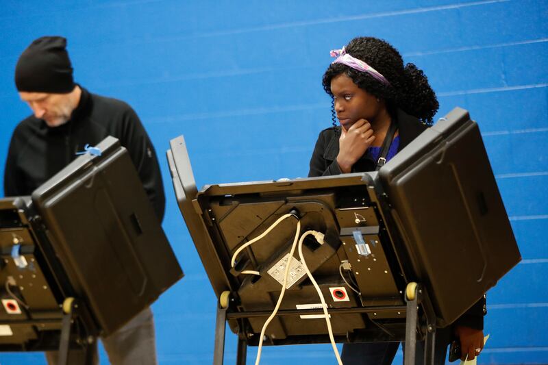 FILE - A voter waits for assistance from a volunteer at the Tuttle Park Recreation Center, Tuesday, Nov. 6, 2018, in Columbus, Ohio.