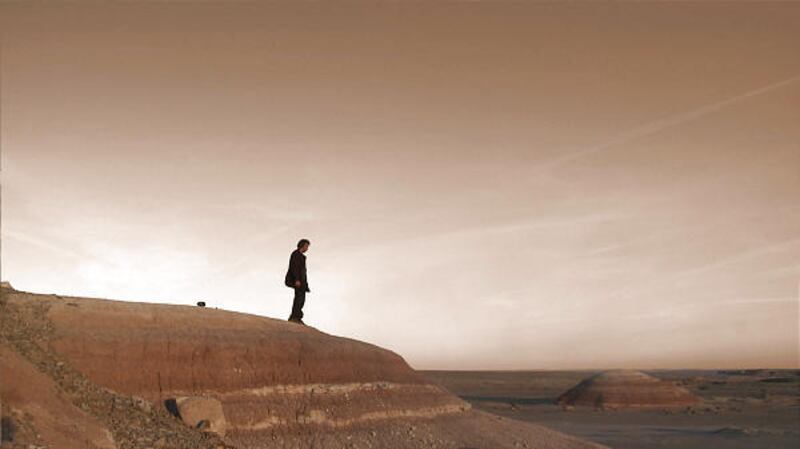 Sergio Garcet, played by Ron Blair, peers over the badlands of southern Utah's San Rafael Desert in the film "Memories of Overdevelopment."