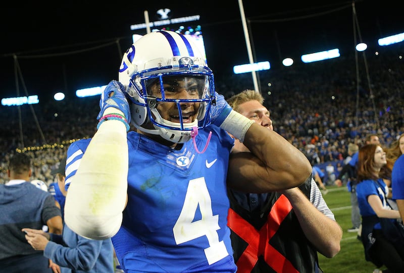 BYU Cougars linebacker Fred Warner (4) celebrates with fans after BYU defeated Mississippi State 28-21 in double overtime in Provo at LaVell Edwards Stadium on Friday, Oct. 14, 2016.