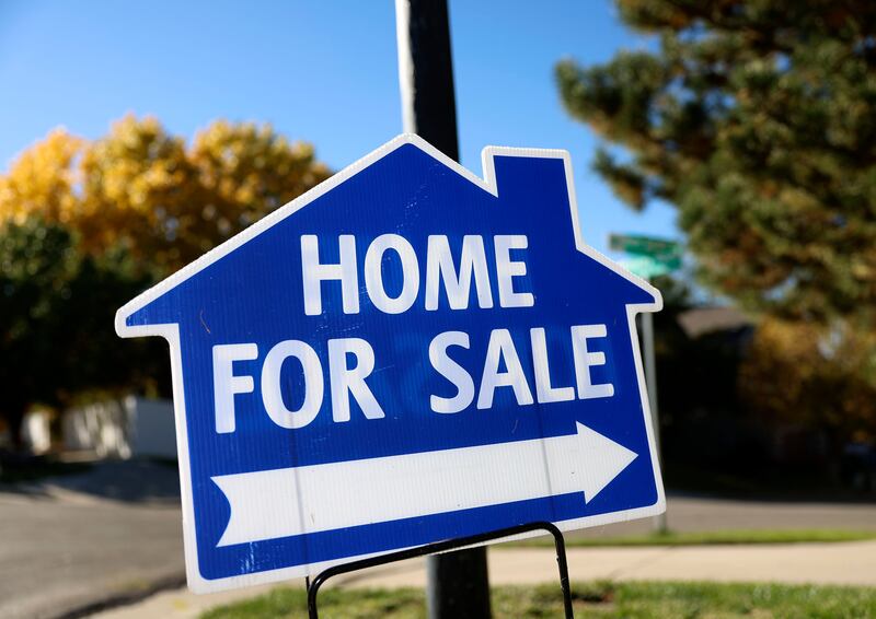 A sign is displayed for a home on the market in Draper on Wednesday, Oct. 18, 2023.