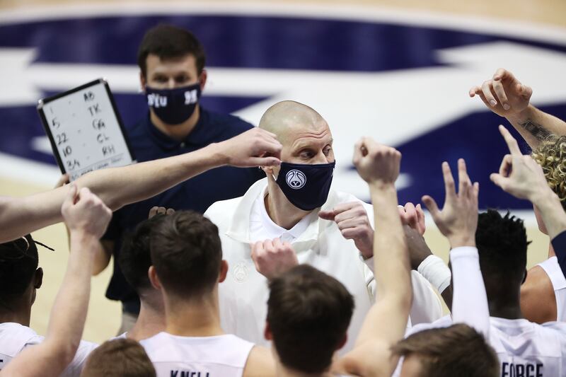 Brigham Young Cougars head coach Mark Pope talks with the team.