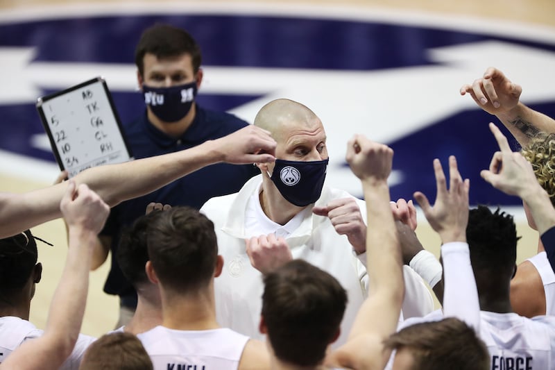 Brigham Young Cougars head coach Mark Pope talks with the team.