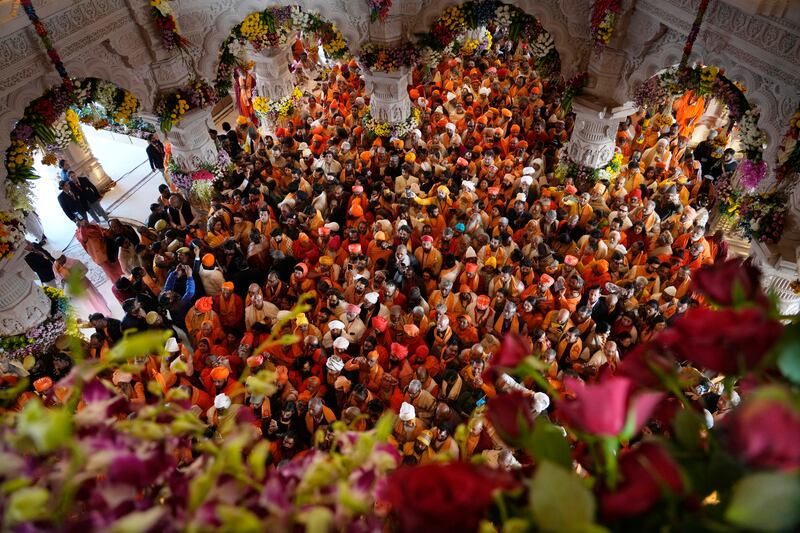 Hindu holy men throng at a temple in Ayodhya, India.