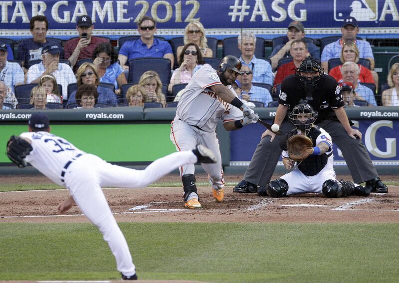 National League's Pablo Sandoval, of the San Francisco Giants, hits a three-run triple on a pitch by American League's Justin Verlander, of the Detroit Tigers, in the first inning the MLB All-Star baseball game Tuesday, July 10, 2012, in Kansas City, Mo.